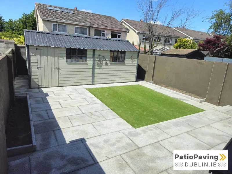 Silver granite patio bordered by lawn in a Lucan garden, Dublin